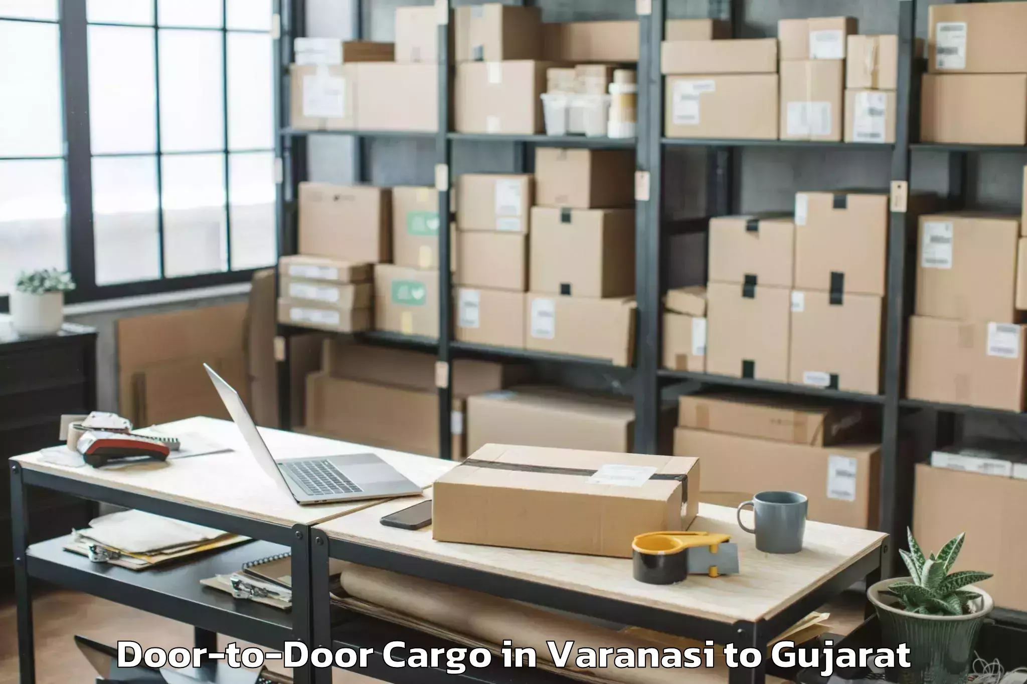 Top Varanasi to Madhav Kampo Door To Door Cargo Available